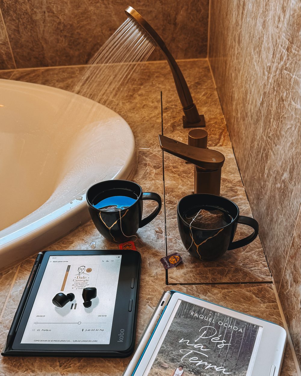 Two Kobo readers beside the bath